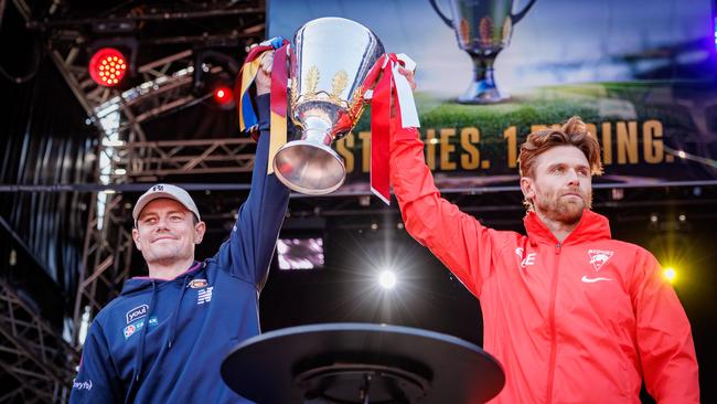 Brisbane’s Lachie Neale and Dane Rampe of the Swans with the AFL premiership cup. Picture: NewsWire / Nadir Kinani