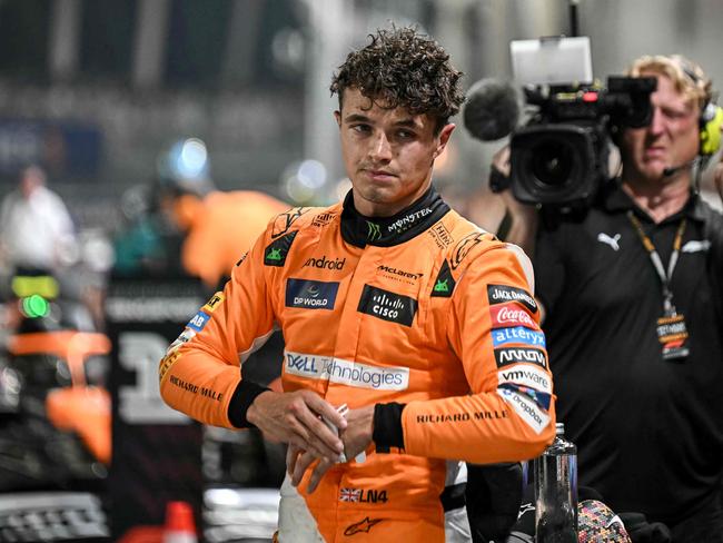 McLaren's British driver Lando Norris looks on after getting pole position in the qualifying session ahead of the Formula One Singapore Grand Prix night race at the Marina Bay Street Circuit in Singapore on September 21, 2024. (Photo by Lillian SUWANRUMPHA / AFP)