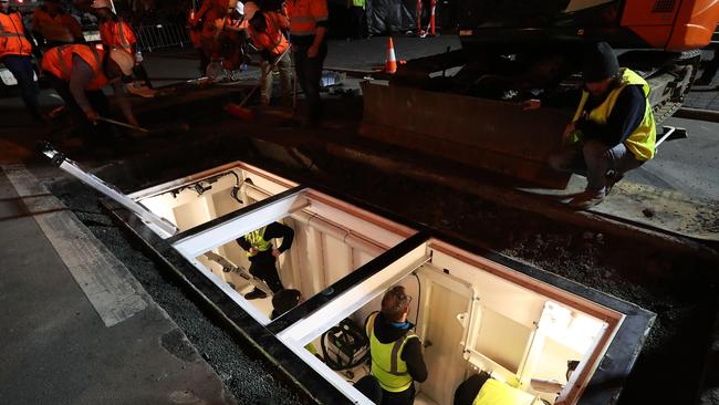 Last minute adjustments in the chamber. Performance artist Mike Parr enters the chamber he will live in for 72 hours under Macquarie Street Hobart. Picture: Nikki Davis-Jones