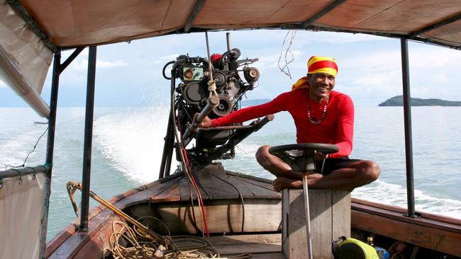 A longtail driver steers his boat on a Four Islands tour from Koh Lanta. Picture: Gary Walsh.