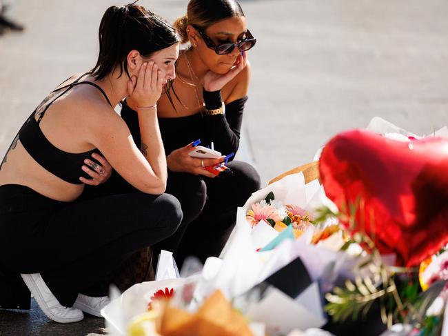 DAILY TELEGRAPH 15 APRIL, 2024:, Floral tributes and condolences from members of the public outside Westfield Bondi Junction this morning after the massacre on the weekend. Picture: David Swift