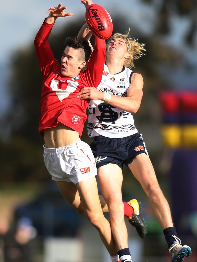 South's Jaidan Kappler spoils North's Connor Rozee. A couple of the young blokes at Noarlunga Oval. Picture: Dean Martin/AAP