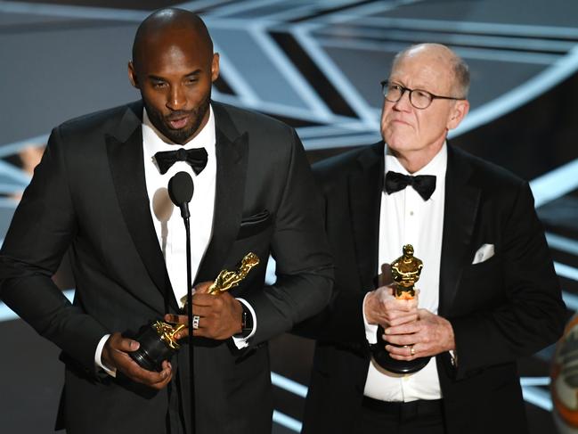 Glen Keane accepting his Oscar with the late Kobe Bryant. Picture: Kevin Winter/Getty Images