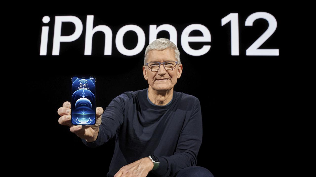 Apple CEO Tim Cook holds up the all-new iPhone 12 Pro during an Apple event on October 13, 2020. Photo: Brooks KRAFT / Apple Inc. / AFP)