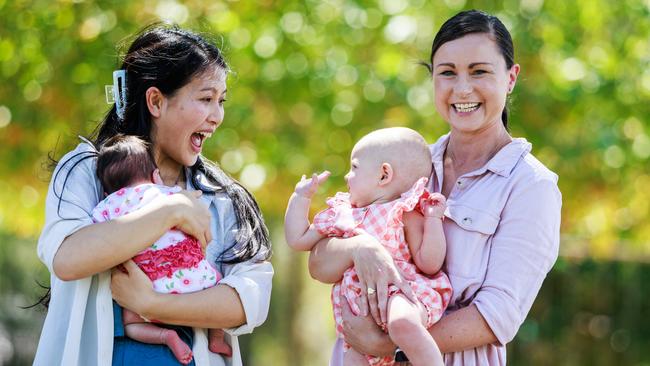 Hudson Institute researchers Nhi Tran, with daughter Kelsi, and Stacey Ellery, with daughter Edie, in Melbourne. Picture: Aaron Francis