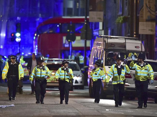 Police officers swarm Borough High Street. Picture: AP