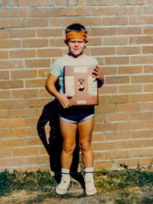 A young Cameron with a sporting award.