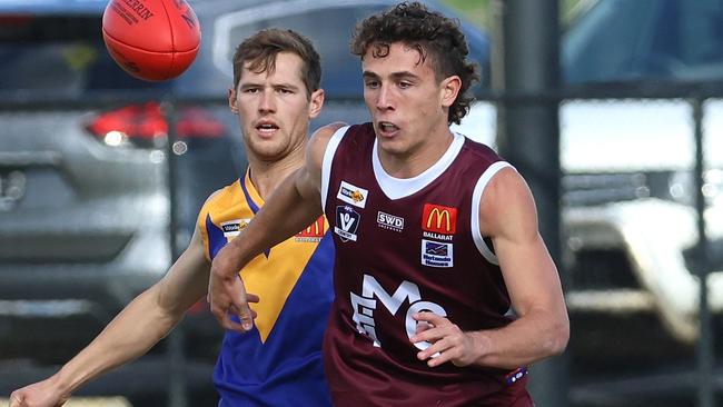 Zach Russell leads the race for the ball for Melton. Picture: Hamish Blair