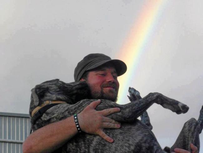 LOVES FOREVER: Matthew Gibbs and his dog Tipsy under the rainbow. Picture: Contributed