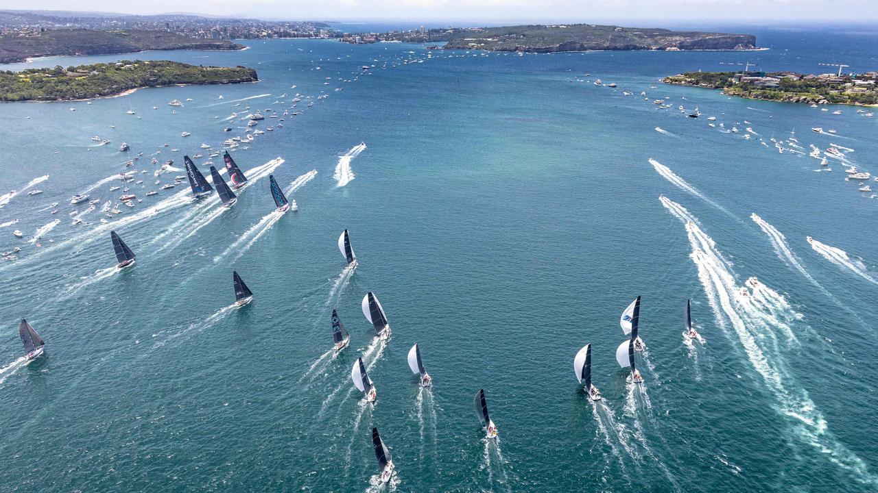 This handout photograph taken on December 26, 2021 and released by Rolex shows yachts sailing out of Sydney harbour at the start of the Sydney to Hobart yacht race.