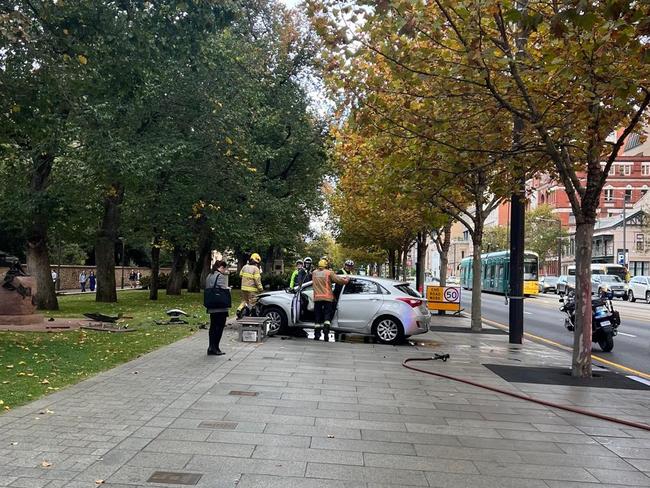 Car slams into sidewalk bench on North Terrace, Adelaide. Picture: Supplied