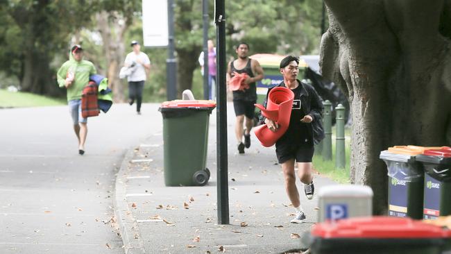 A few revellers make a run for it at Mrs Macquarie's Chair. Picture: Dylan Robinson