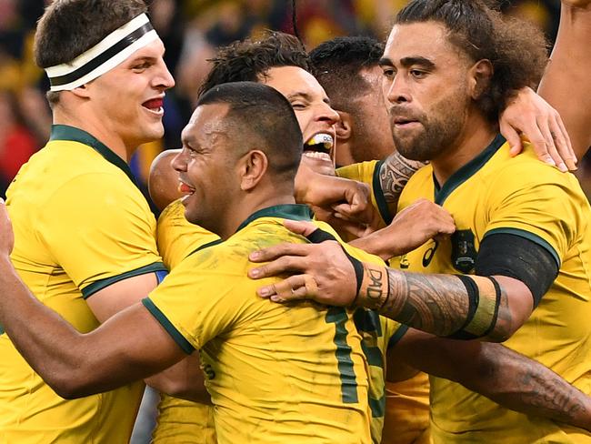 Kurtley Beale of the Wallabies (centre) celebrates with team mates after scoring a try during the Bledisloe Cup match between the Australian Wallabies and the New Zealand All Blacks at Optus Stadium in Perth, Saturday, August 10, 2019.  (AAP Image/Dave Hunt) NO ARCHIVING, EDITORIAL USE ONLY