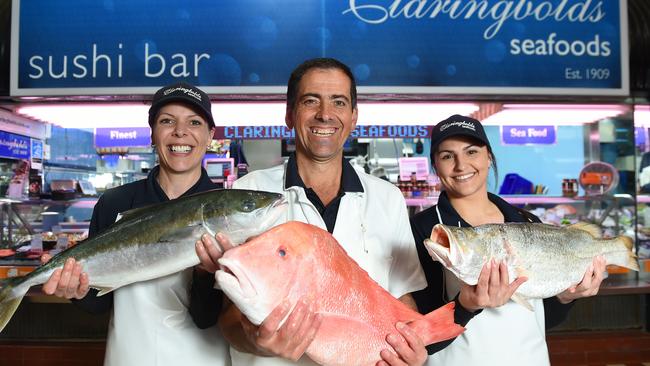 Peter Tsiboukis with Louise Markowski (left) and Nicole Megas outside Claringbolds Seafoods. Picture: Josie Hayden