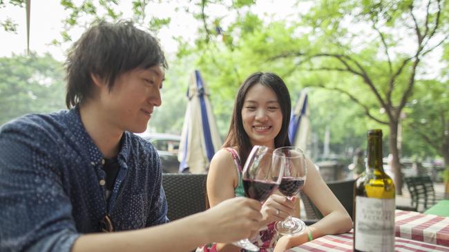 A couple drink Australian wine in Beijing. (Picture: Shannon Fagan)