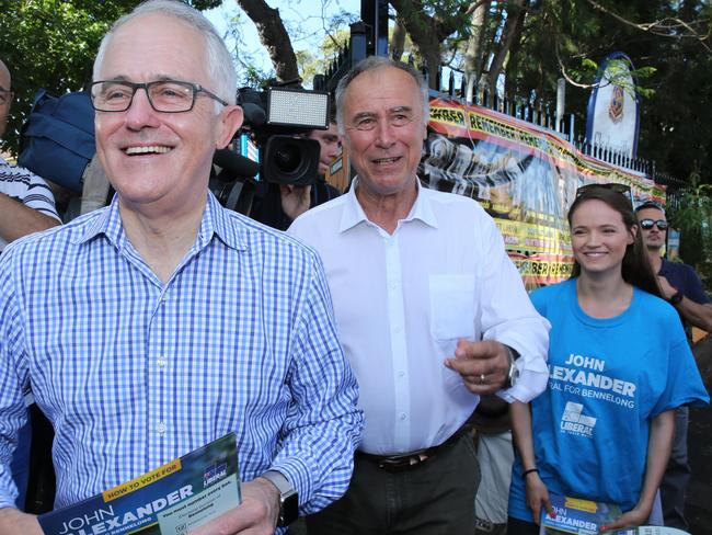 Prime Minister Malcolm Turnbull with the Liberal Candidate for Bennelong John Alexander and his daughter Georgia, at Gladesville Public School today. Picture: Tim Hunter.