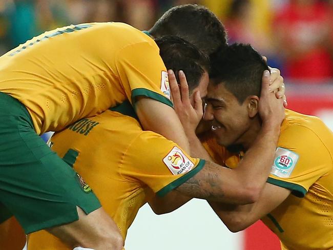 SYDNEY, AUSTRALIA - JANUARY 31: Matt McKay, James Troisi and Massimo Luongo of Australia celebrate victory during the 2015 Asian Cup final match between Korea Republic and the Australian Socceroos at ANZ Stadium on January 31, 2015 in Sydney, Australia. (Photo by Mark Kolbe/Getty Images)