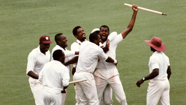 Glory days: Fast bowler Courtney Walsh and teammates celebrate a famous victory over Australia in Adelaide, 1993. Picture: News Corp