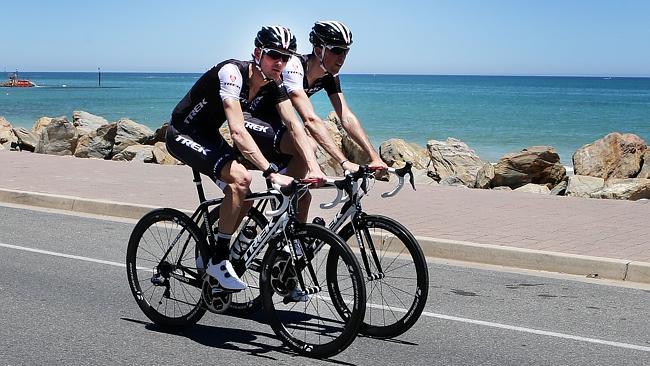 Frank Schleck (left) takes a short ride down to Glenelg along the beach after arriving in Adelaide. Picture: Sarah Reed.