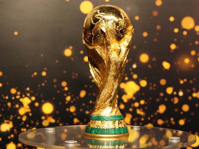 (FILES) This file photo taken on May 12, 2006 shows the FIFA World Cup trophy presented to the public in Berlin.  FIFA's ruling council on January 10, 2017 unanimously approved an expansion of the World Cup to 48 teams in 2026, with a format of 16 groups of three nations. / AFP PHOTO / BARBARA SAX