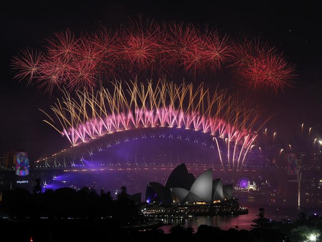 The Sydney Harbour Bridge lights up early on in the 20 minute spectacular. Picture: Toby Zerna