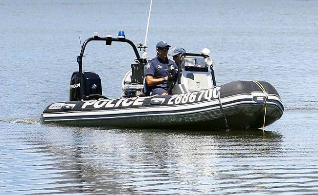 Police search Lake Moogerah as the mystery of the missing woman continues.  . Picture: Claudia Baxter