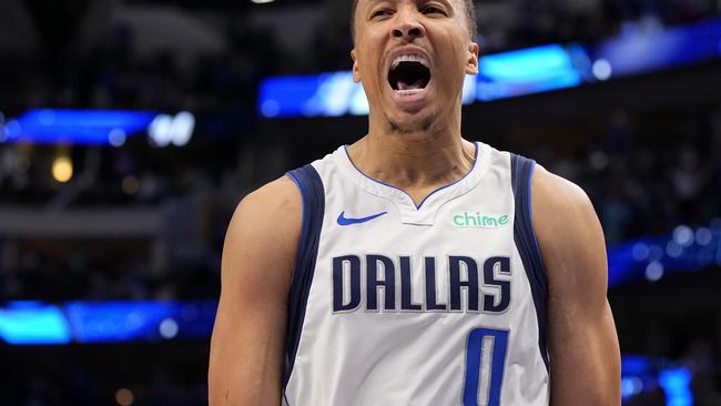 DALLAS, TEXAS - APRIL 07: Dante Exum #0 of the Dallas Mavericks reacts after making a buzzer beater 3-pt basket to tie the game in the fourth quarter and force overtime against the Houston Rockets at American Airlines Center on April 07, 2024 in Dallas, Texas. NOTE TO USER: User expressly acknowledges and agrees that, by downloading and or using this photograph, User is consenting to the terms and conditions of the Getty Images License Agreement. (Photo by Sam Hodde/Getty Images)