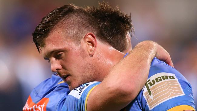 Ross Haylett-Petty is embraced by his brother Dane after playing his first game for the Force.