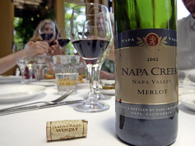 ** FILE ** Napa Creek Winery merlot is tasted at the Bistro Don Giovanni restaurant in this file photo June 24, 2005, in Napa, Calif. Within days of losing a battle in the U.S. Supreme Court, Fred Franzia, head of Bronco Wine Co. based in Central California, who created "Two-buck Chuck" wine, launched the Napa Creek label which is made 85 percent from grapes grown in the Napa Valley. Bronco unsuccessfully challenged the law all the way to the U.S. Supreme Court, and recently agreed to abide by the requirement that wines sporting "Napa" on the label be made with grapes from that region. (AP Photo/Eric Risberg, File)