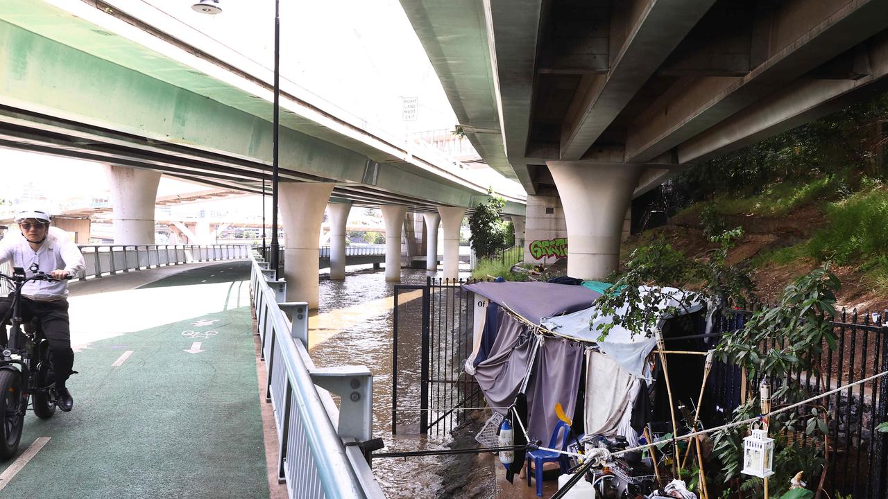 A makeshift home next to the Bicentennial Bikeway and beneath the Riverside Expressway. Picture: David Clark