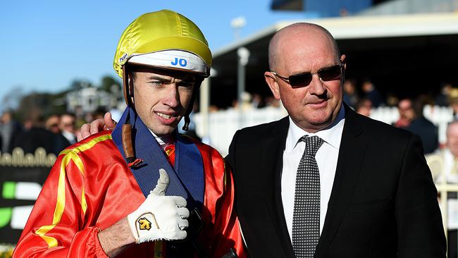 Trainer Toby Edmonds (right) with jockey James Orman. Picture: AAP Image/Albert Perez