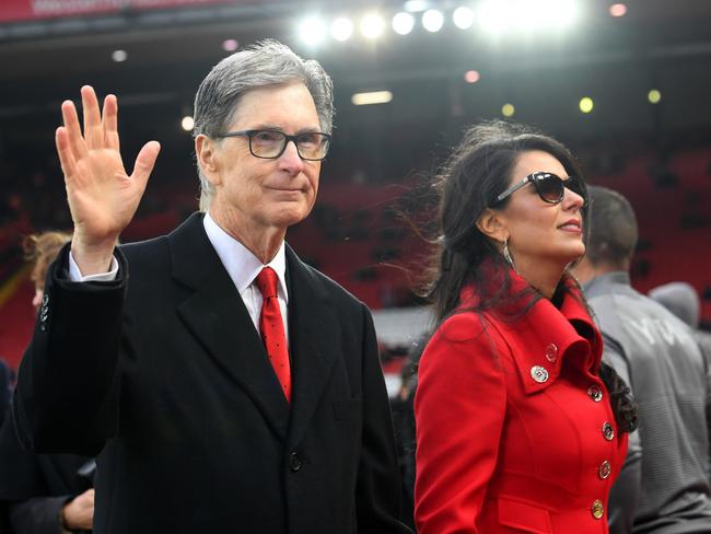 FILE: Fenway Sports Group Puts Liverpool Football Club Up For Sale LIVERPOOL, ENGLAND - APRIL 26:  Liverpool owner John W. Henry and wife, Linda Pizzuti walk on the pitch prior to the Premier League match between Liverpool FC and Huddersfield Town at Anfield on April 26, 2019 in Liverpool, United Kingdom. (Photo by Michael Regan/Getty Images)