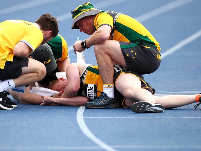 Jesse Costelloe of Australia receives medical attention following the Men's 1500m IT7. Picture: Cameron Spencer/Getty Images for the Invictus Games Foundation