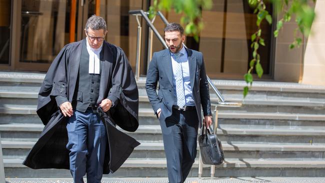 Defence lawyer Patrick Wilson, left, leaves court after the appeal hearing. Picture: Linda Higginson