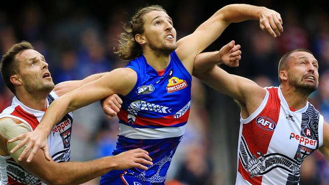 Marcus Bontempelli takes on Nathan Brown and Jarryn Geary. Picture: Mark Stewart