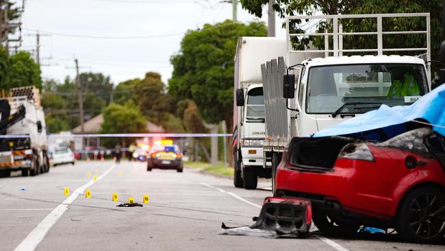 Wreckage is strewn across Radford Rd, Reservoir after this Holden Commodore slammed into the back of a parked truck. Picture: Sarah Matray