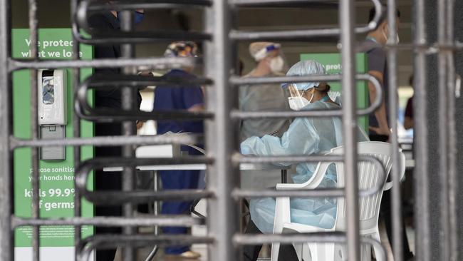 DHHS staff at the MCG testing site after it was listed as a potential exposure site. Picture: NCA NewsWire / David Geraghty