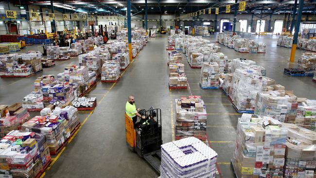 Forklifts move stock at Woolworths distribution centre at Minchinbury in SydneyÕs west,  Wednesday 18 March 2020. Australian supermarket chains are working hard to maintain stock levels for the shelves. Picture: Nikki Short