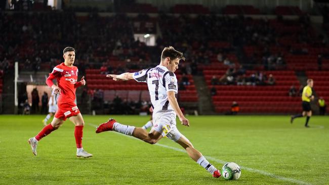 Adelaide City’s Joel Allwright with the ball during the grand final. PICTURE: ADAM BUTLER