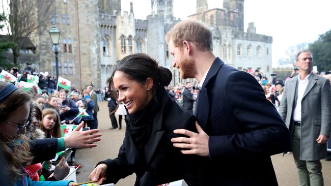 Prince Harry and Meghan Markle sign autographs and shake hands with children at Cardiff Castle (Photo by Chris Jackson/Chris Jackson/Getty Images)