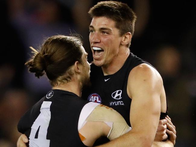 MELBOURNE, AUSTRALIA - MAY 15: Matthew Kreuzer of the Blues (right) celebrates the match winning goal with Bryce Gibbs of the Blues during the 2016 AFL Round 08 match between the Carlton Blues and Port Adelaide Power at Etihad Stadium, Melbourne on May 15, 2016. (Photo by Adam Trafford/AFL Media/Getty Images)