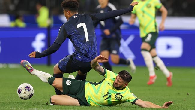 Brandon Borrello lays a tackle on a tough night for the Socceroos. (Photo by Robert Cianflone/Getty Images)