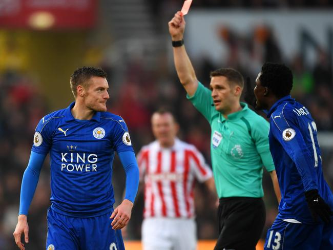 Jamie Vardy of Leicester City (L) is shown a red card by referee Craig Pawson.