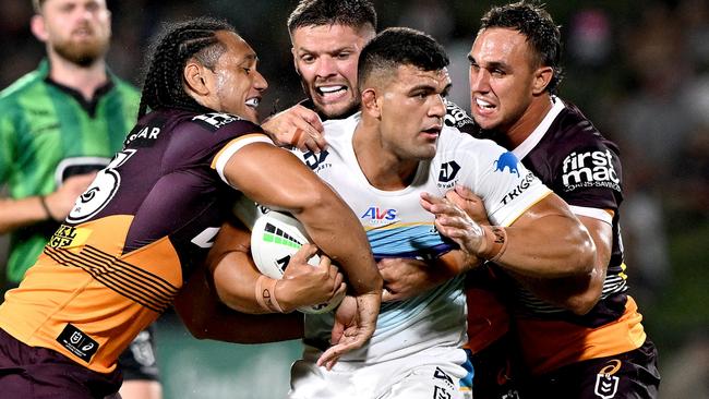 David Fifita of the Titans is wrapped up by the defence during the NRL Trial Match between the Brisbane Broncos and Gold Coast Titans at Sunshine Coast Stadium on February 12, 2023 in Sunshine Coast, Australia. (Photo by Bradley Kanaris/Getty Images)