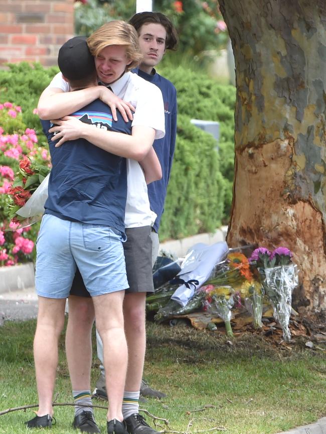 Friends mourn Hector Ryan at the scene of the fatal crash. Picture: Jay Town