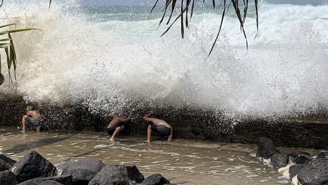 Young kids were spotted playing a dangerous game with the large surf at Froggy's Beach near Snapper Rocks. Picture: Kathleen Skene