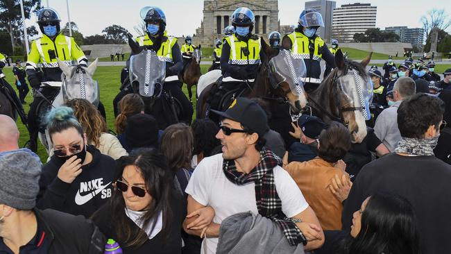 Protesters and police at the Shrine of Remembrance.