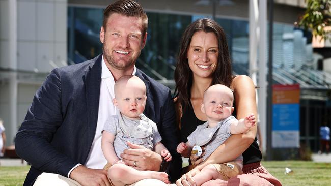 Sam Groth with his wife Brittany with their 10-month-old twins, Mason and Parker. Picture: Michael Klein