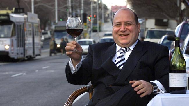 Rinaldo Di Stasio enjoys a wine outside his restaurant in Fitzroy St, St Kilda. Picture: David Geraghty