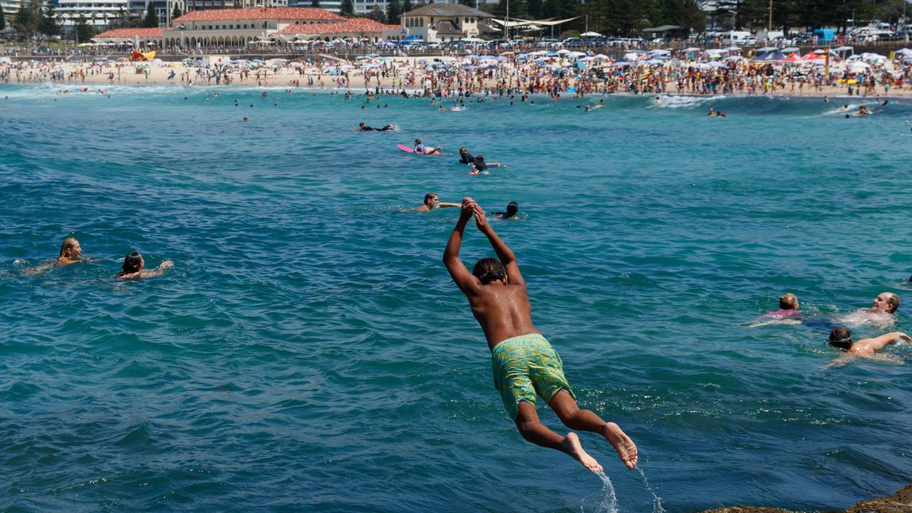 Crowds flocked to Bondi Beach as temperatures climbed on Monday ahead of Tuesday’s scorcher. Picture: Max Mason-Hubers